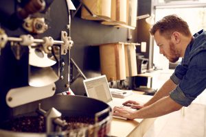 tradesman-looking-at-laptop